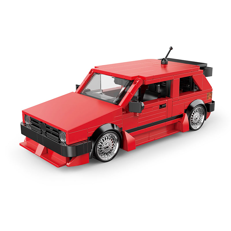 Red toy car model on a white background