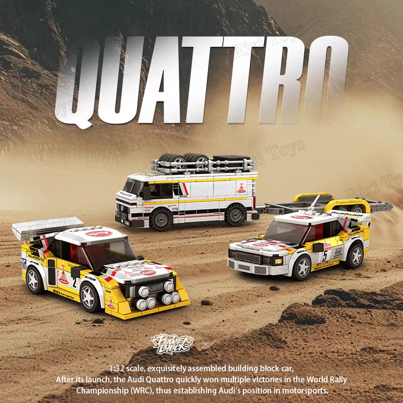 Toy model of Audi Quattro cars on a desert background with 'QUATTRO' text.