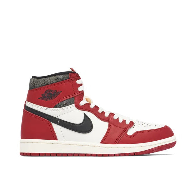 Red and white sneaker with black accents on a white background